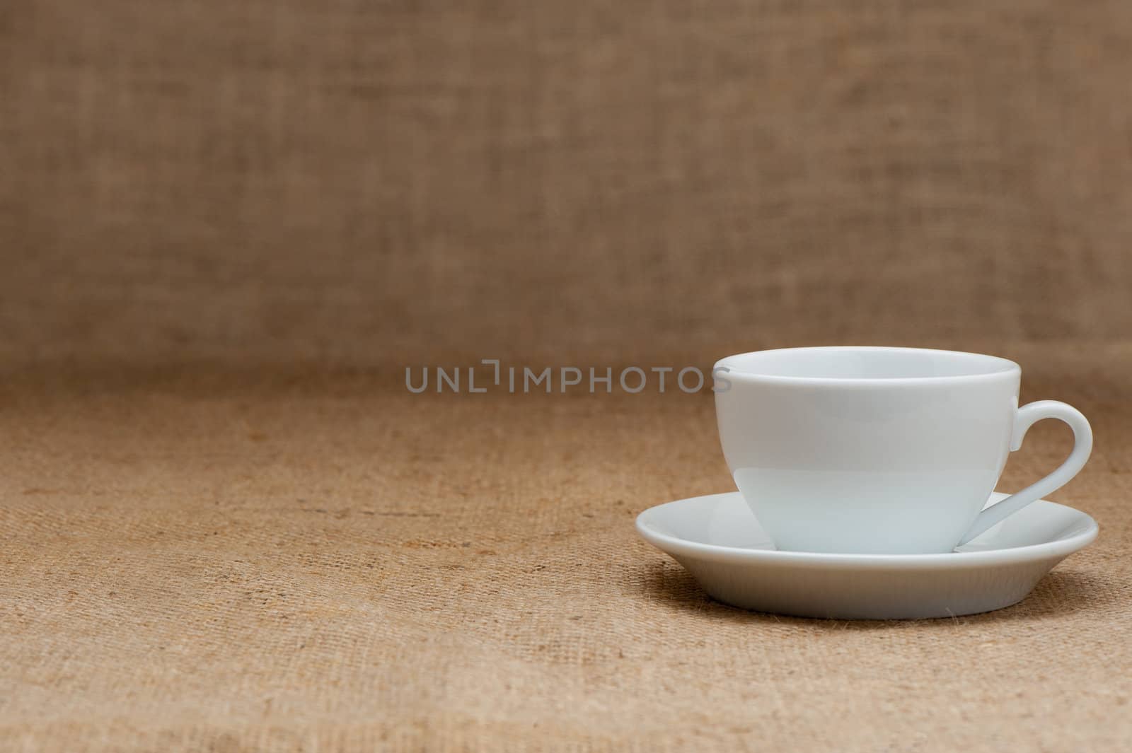 Empty white coffee cup. Grunge background