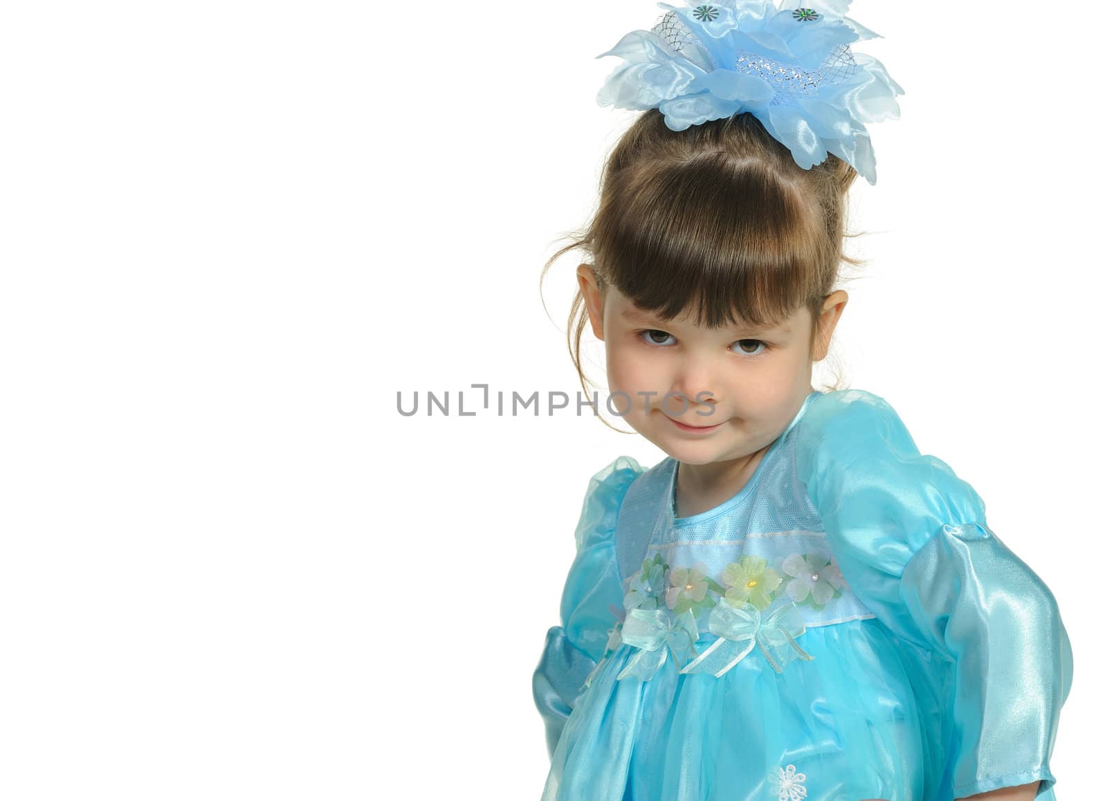 Pretty the little girl in a blue dress. It is isolated on a white background