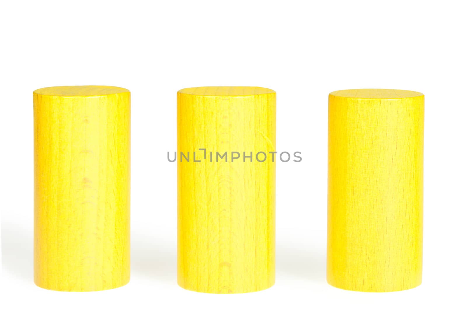 Wooden colour cylinders. It is isolated on a white background