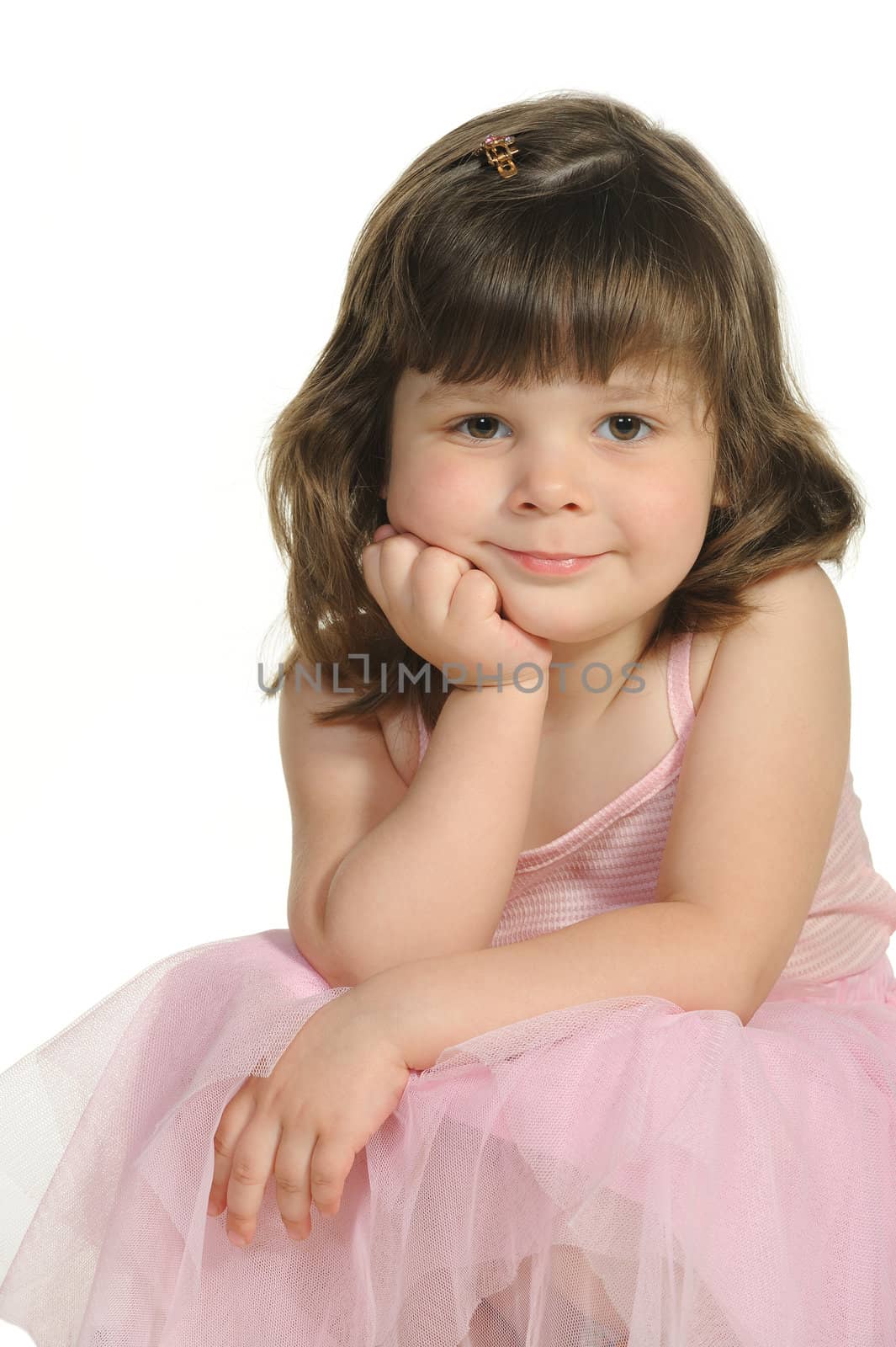 The lovely little girl close up. It is isolated on a white background