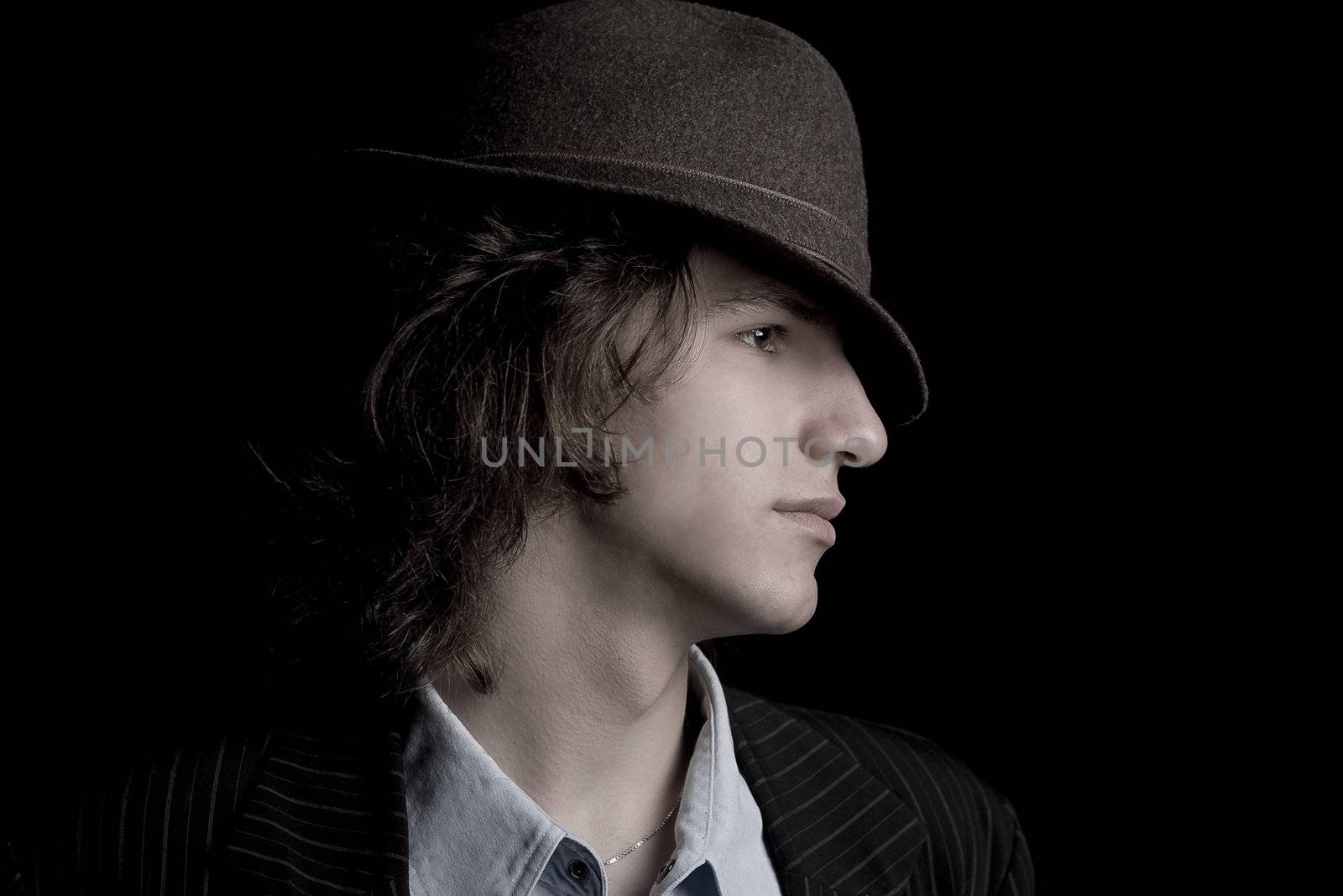 Profile of a male teenager with a hat with desaturated effect
