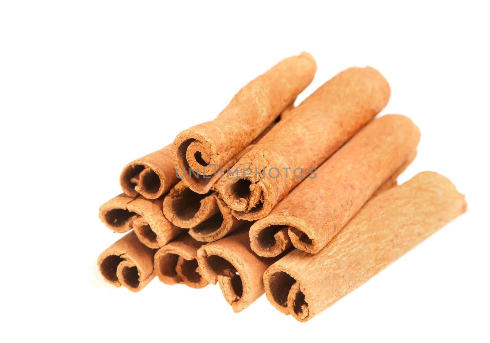 Cinnamon. A heap of sticks of cinnamon on a white background