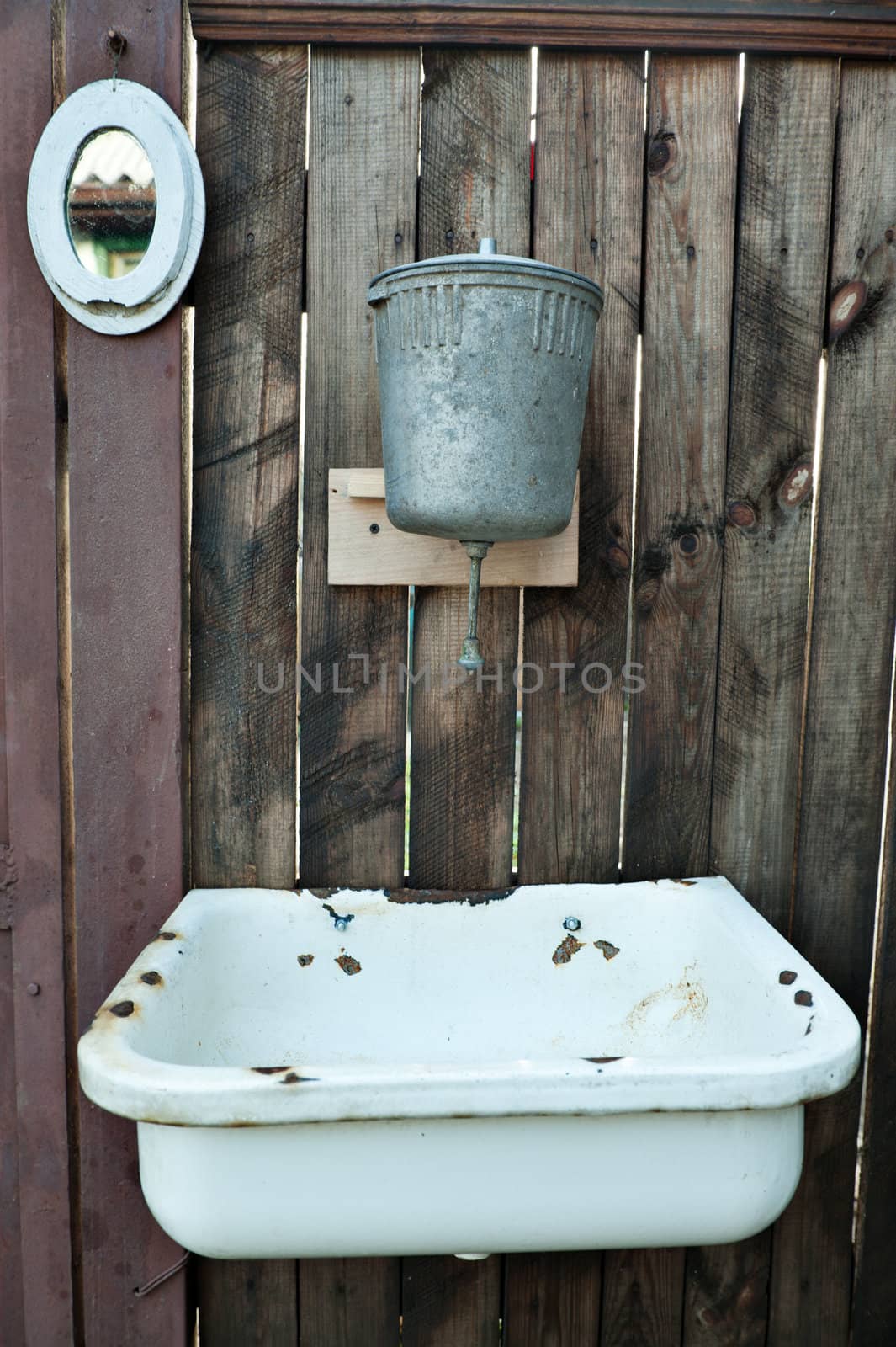Old washstand. The adaptation for washing on a fence.