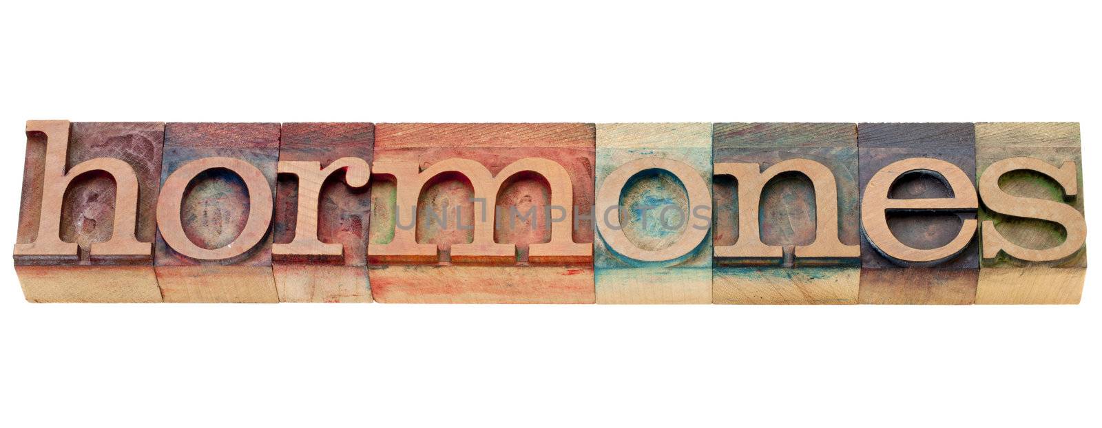 hormones -  health concept - isolated word in vintage wood letterpress printing blocks stained by color inks