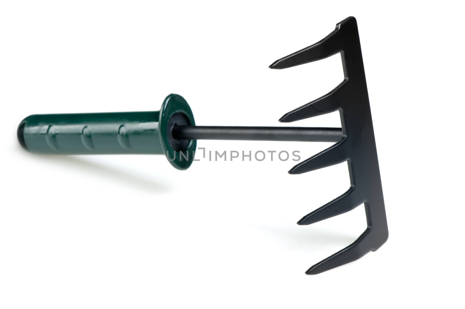 The garden tool a rake. Isolated on a white background