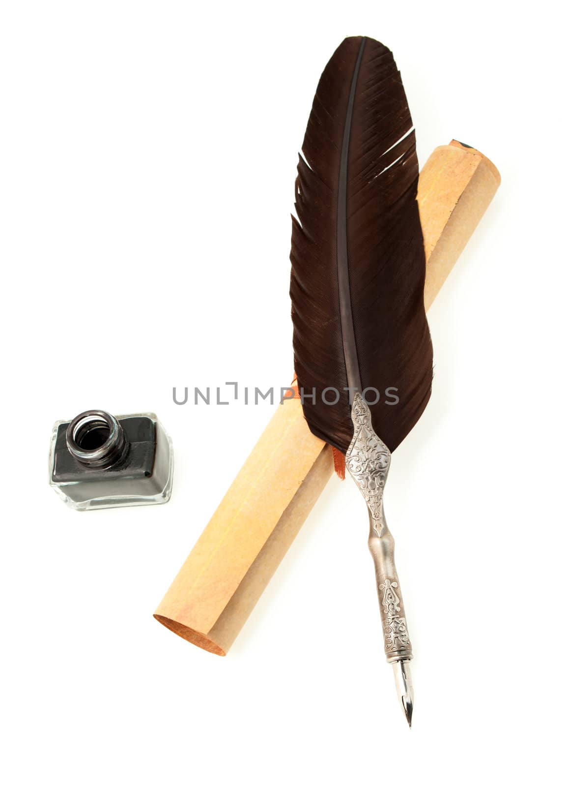 Feather quill ,inkwell and parchment roll. Isolated on white