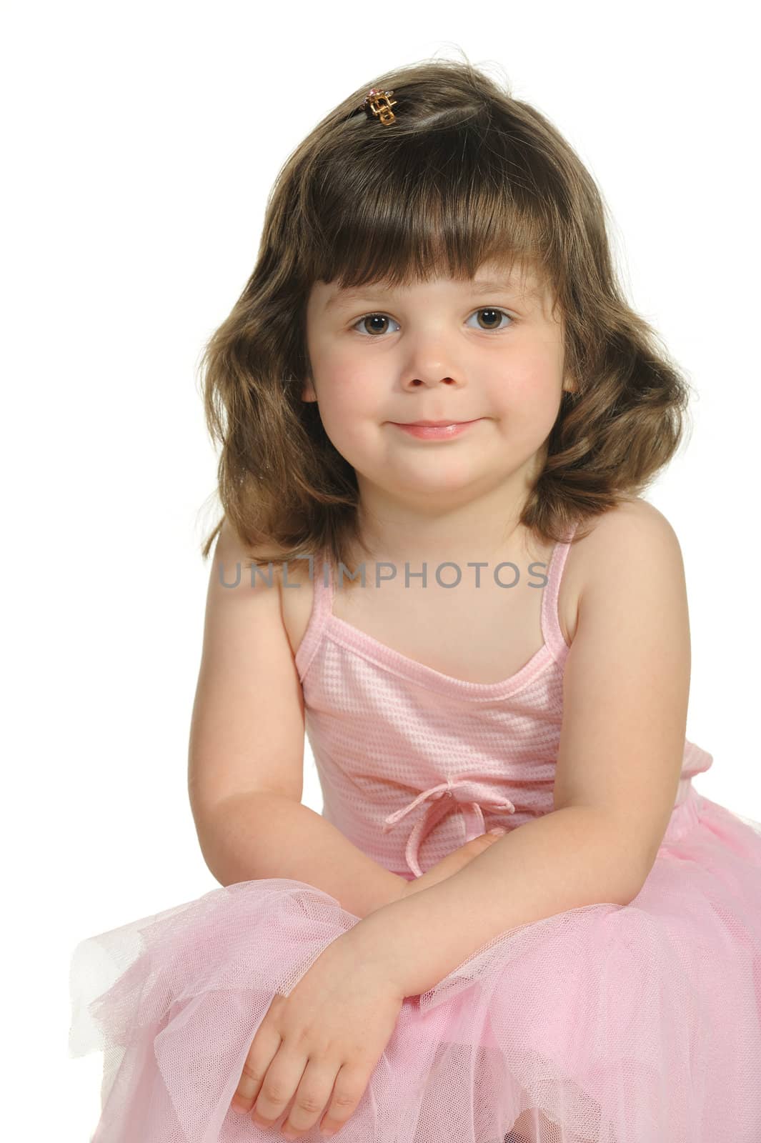 The lovely little girl close up. It is isolated on a white background