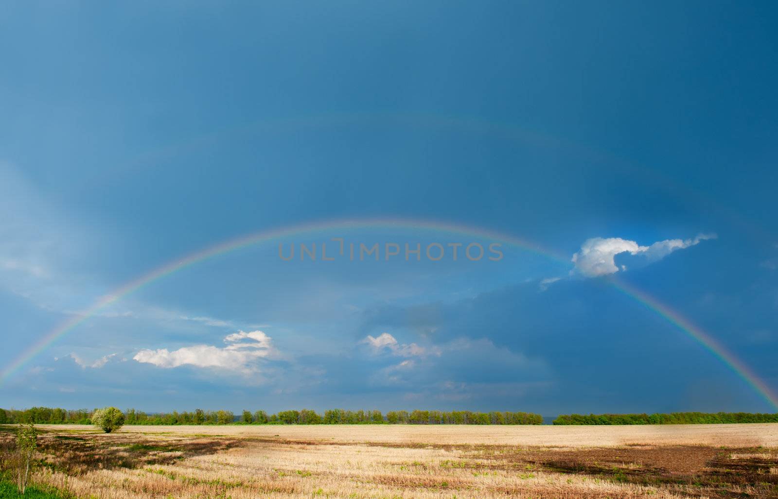 Rainbow. A landscape with a rain and a rainbow.