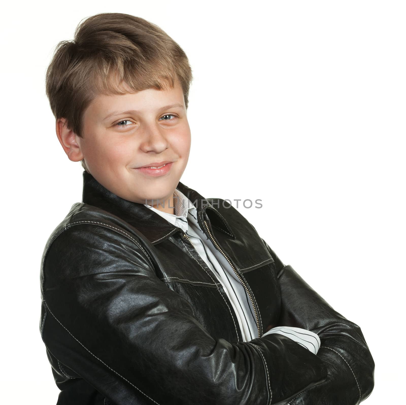 Portrait of the teenager in a leather jacket. It is isolated on a white background