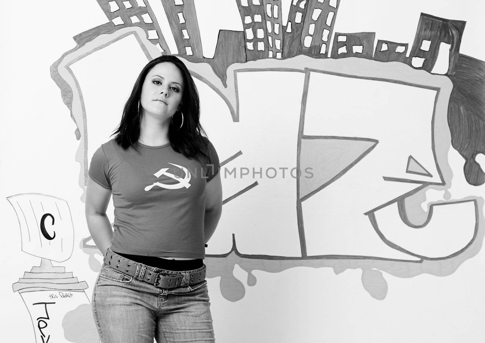 portrait of a sexy young women in front of a graffiti in black and white