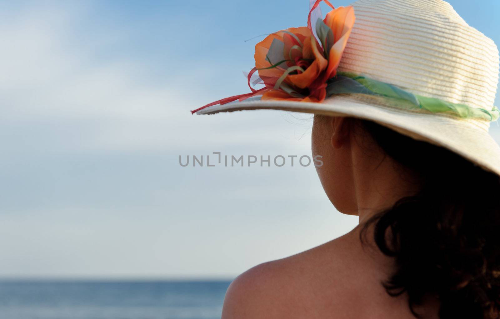 The girl in a hat against the blue sky by galdzer