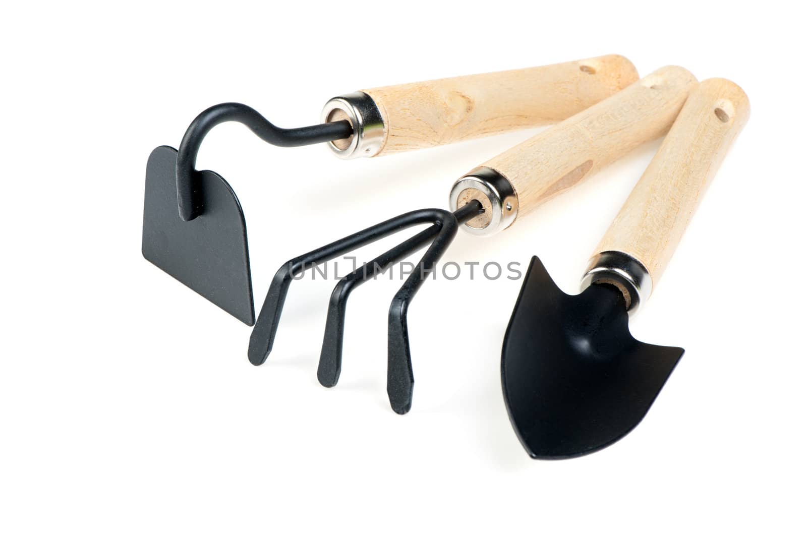 The garden tool a shovel, a rake, a chopper. Isolated on a white background