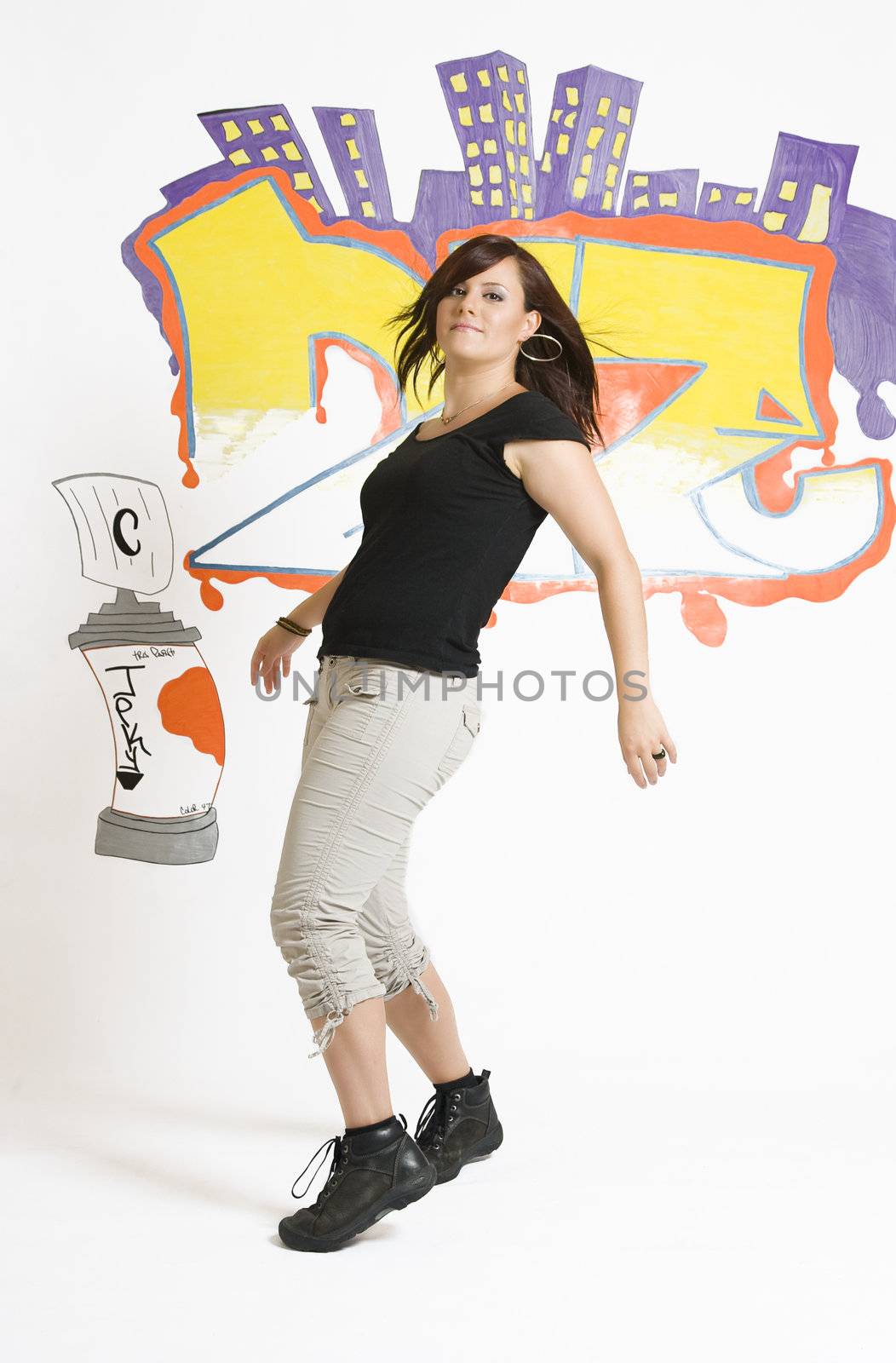Late twenties break dancing girl side stepping to the left