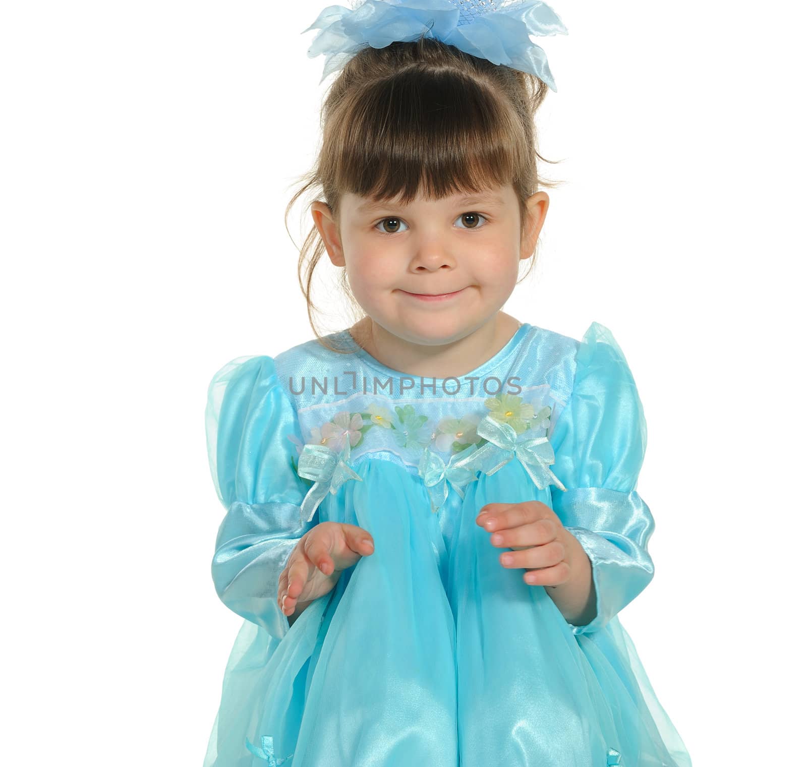 Pretty the little girl in a blue dress. It is isolated on a white background