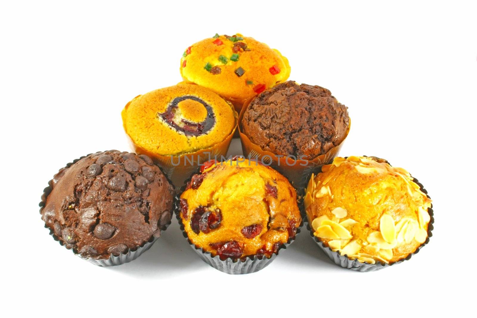 Assorted Cupcakes and Muffins Freshly Baked on White Surface