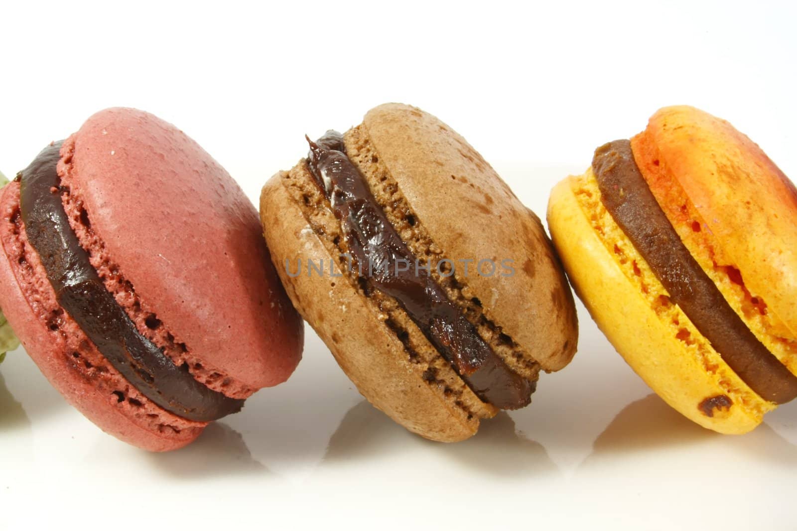 Macaroons Group on a Reflective White Background