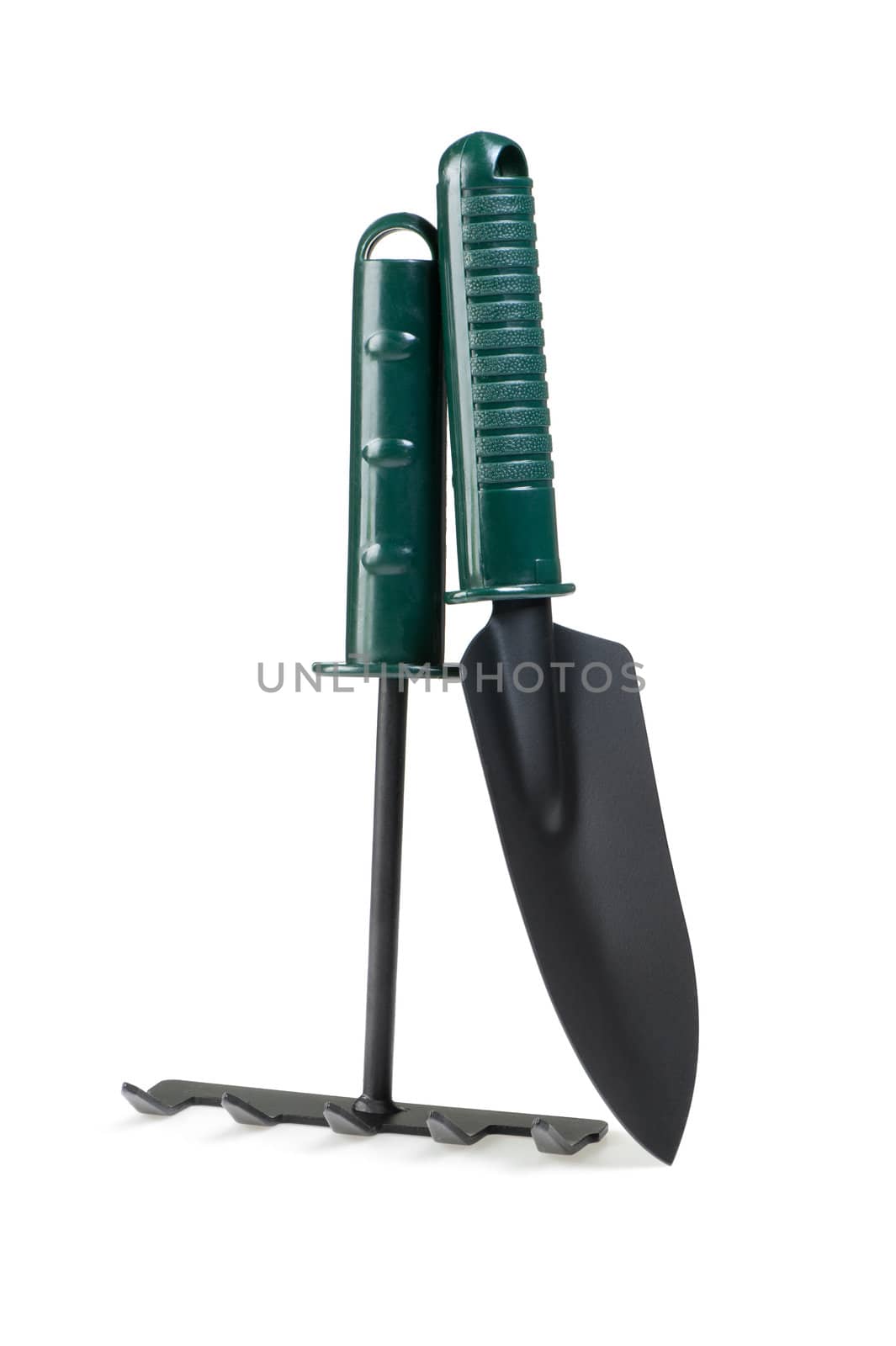 The garden tool a shovel, a rake. Isolated on a white background