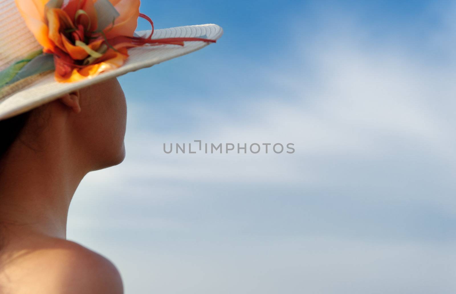 The girl in a hat against the blue sky by galdzer