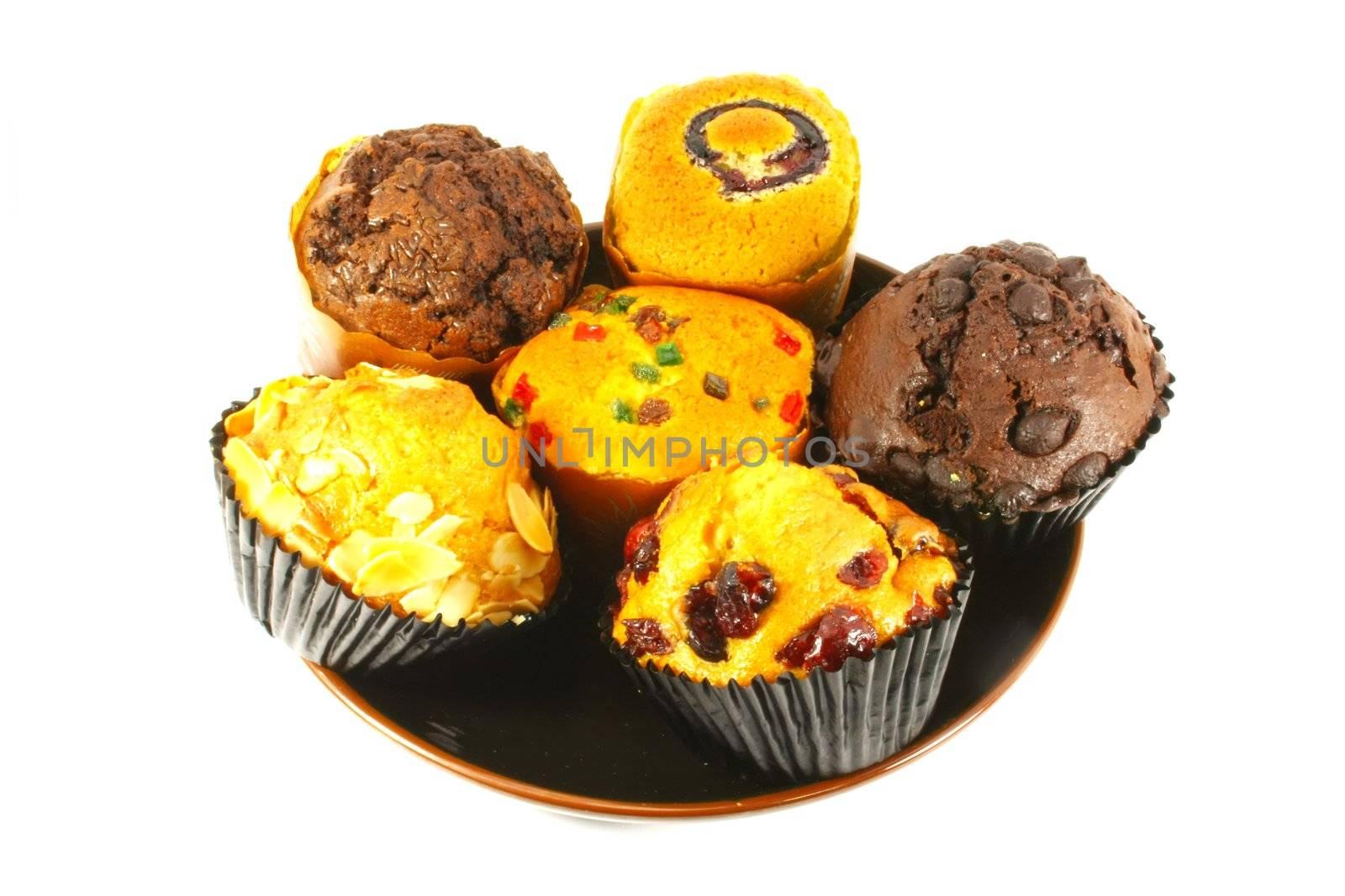 Assorted Cupcakes and Muffins Freshly Baked on White Surface