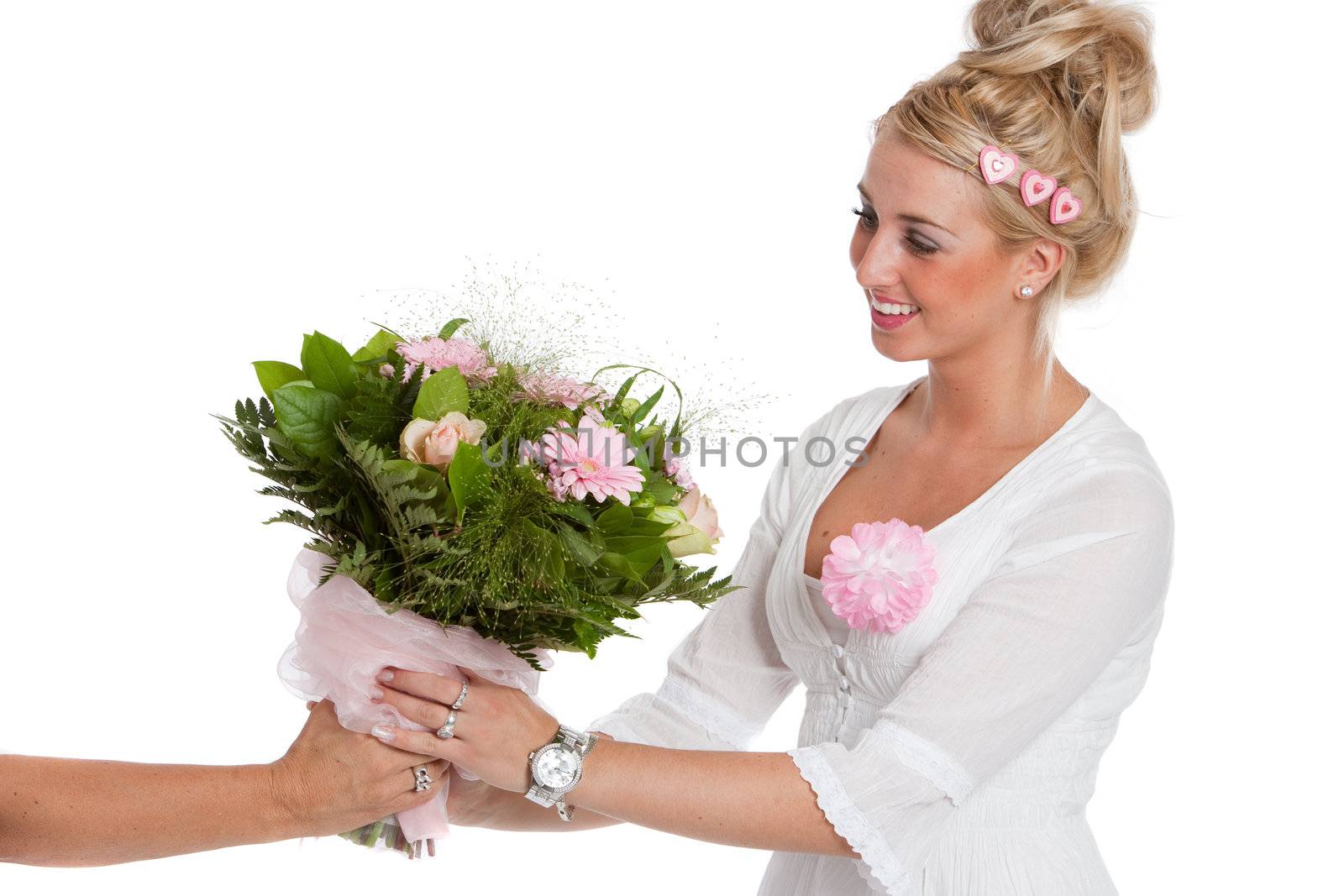 Beautiful young woman receiving a bunch of pink flowers