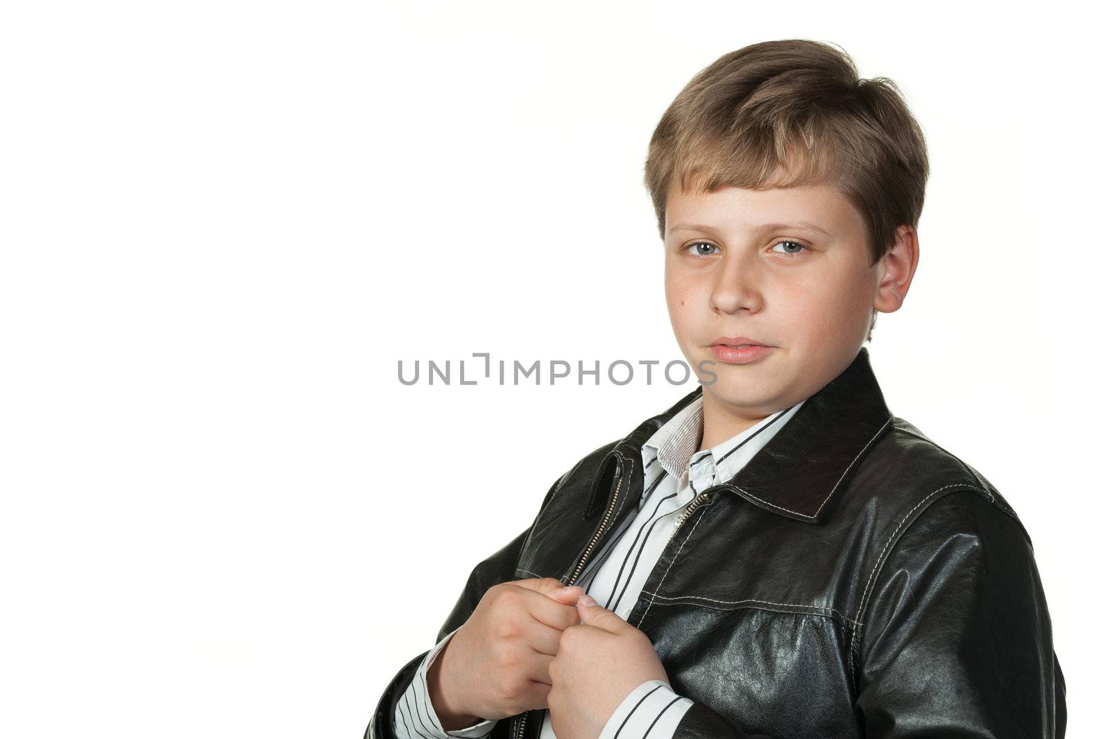 Portrait of the teenager in a leather jacket. It is isolated on a white background