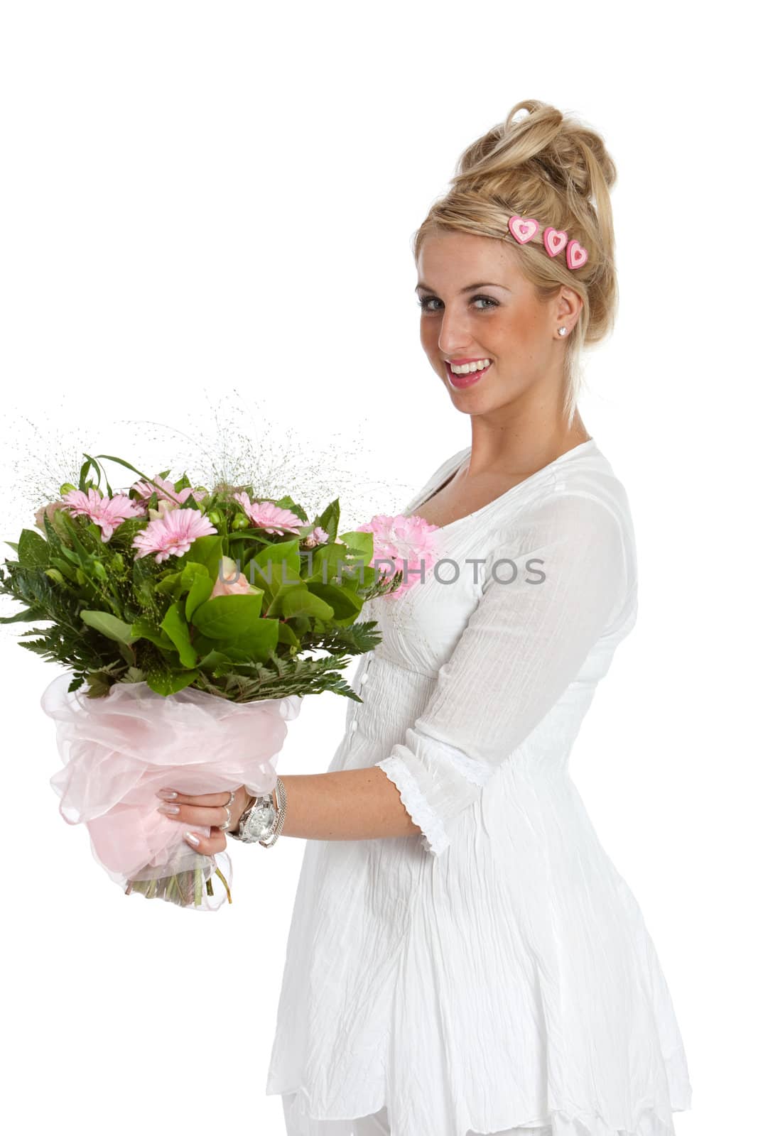 Pretty blond girl looking happy with a bouquet of flowers in her hands