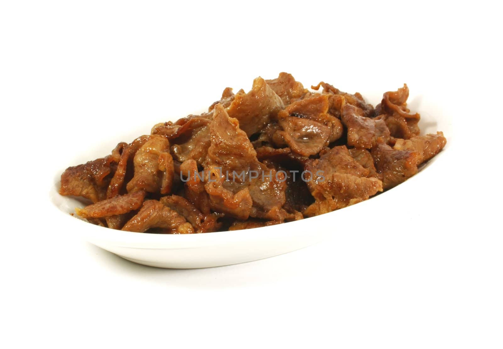 Stir Fried Beef Stips on a White Surface