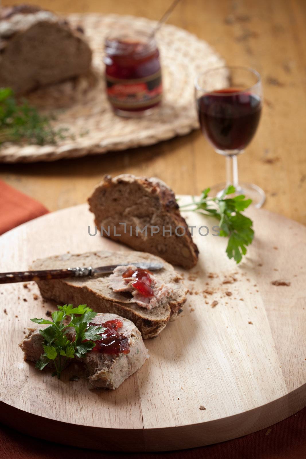 Delicious homemade pate with a glass of wine and bread