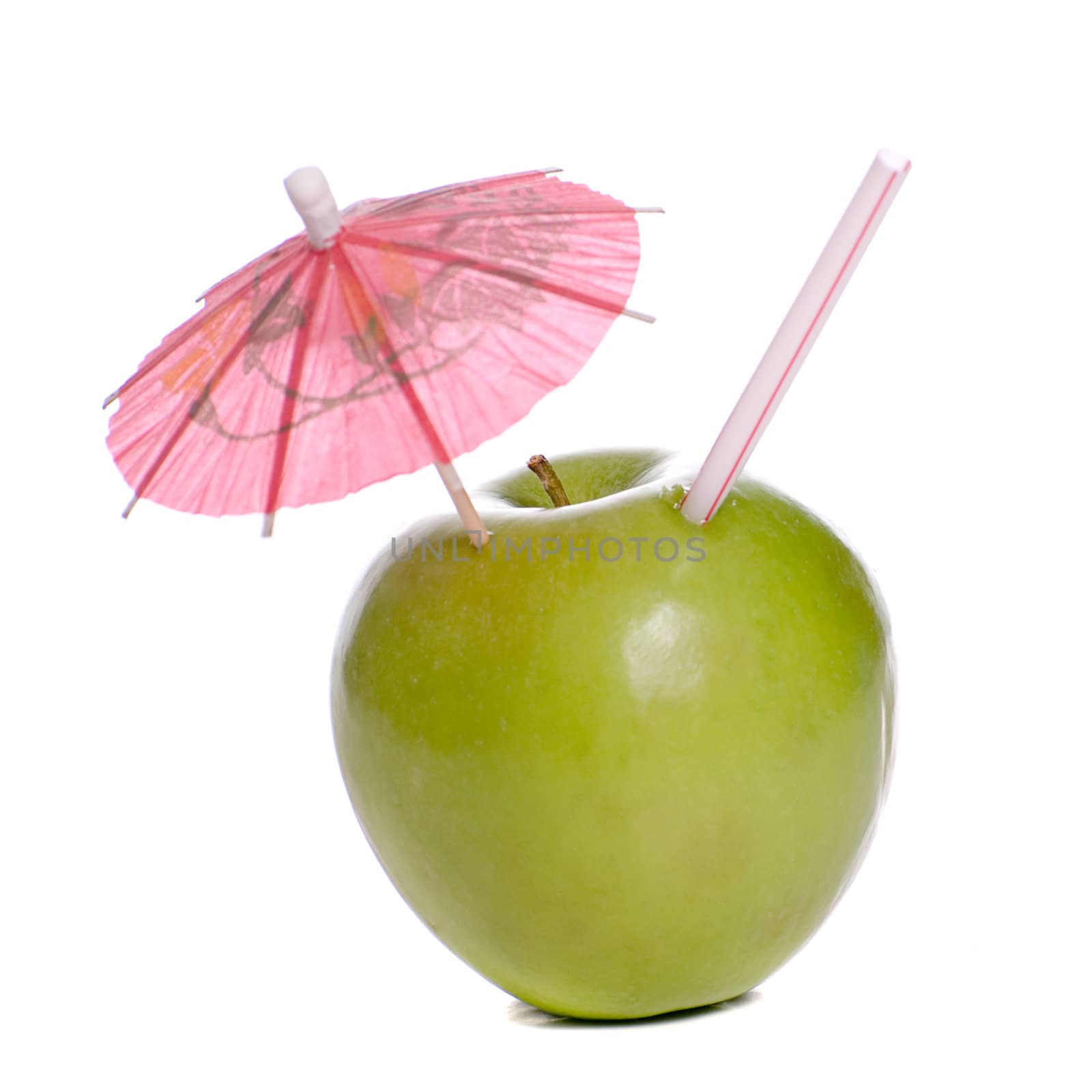 Concept image of fresh apple juice featuring an apple with a straw and an umbrella in it