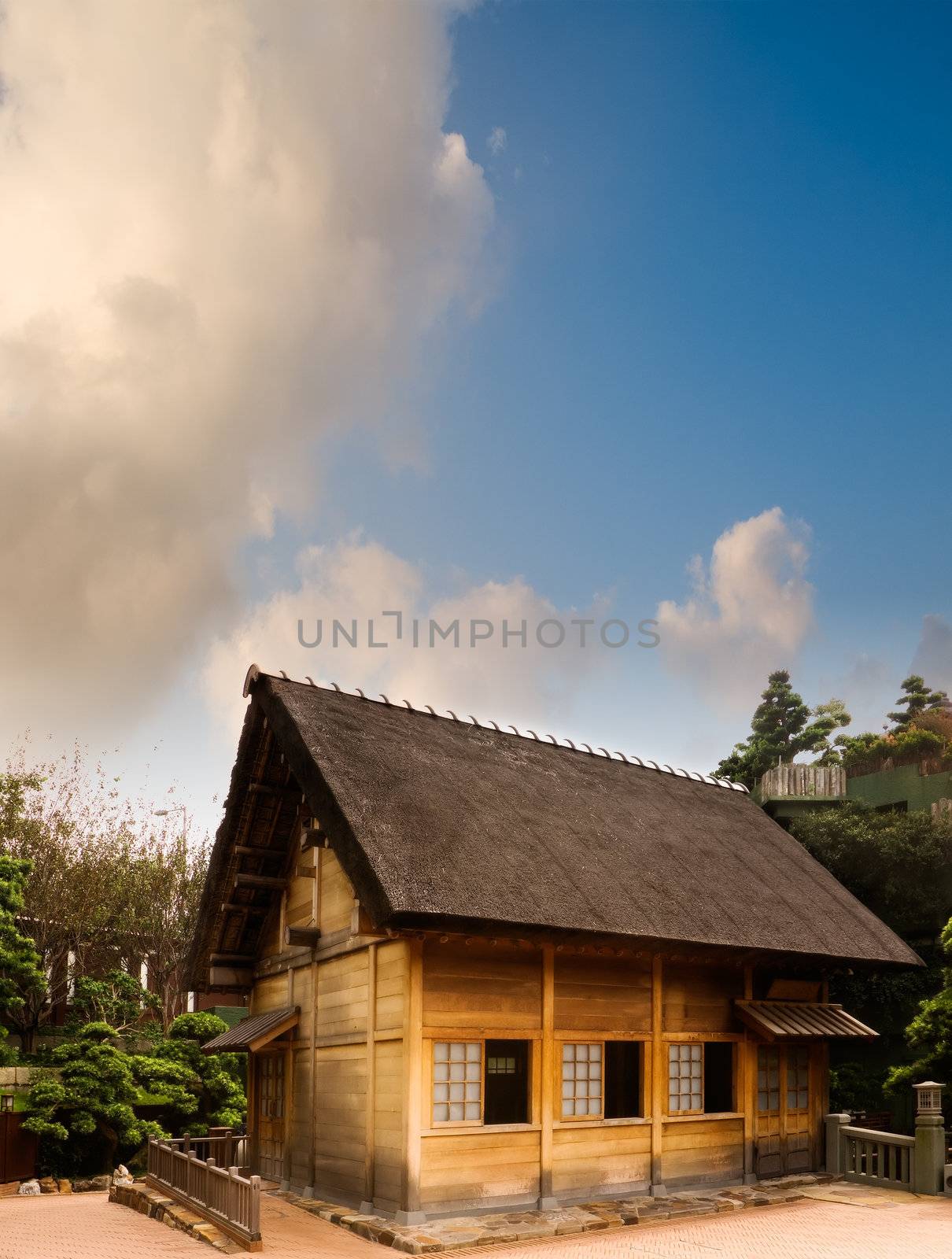 Beautiful landscape traditional Chinese wooden house under blue sky.