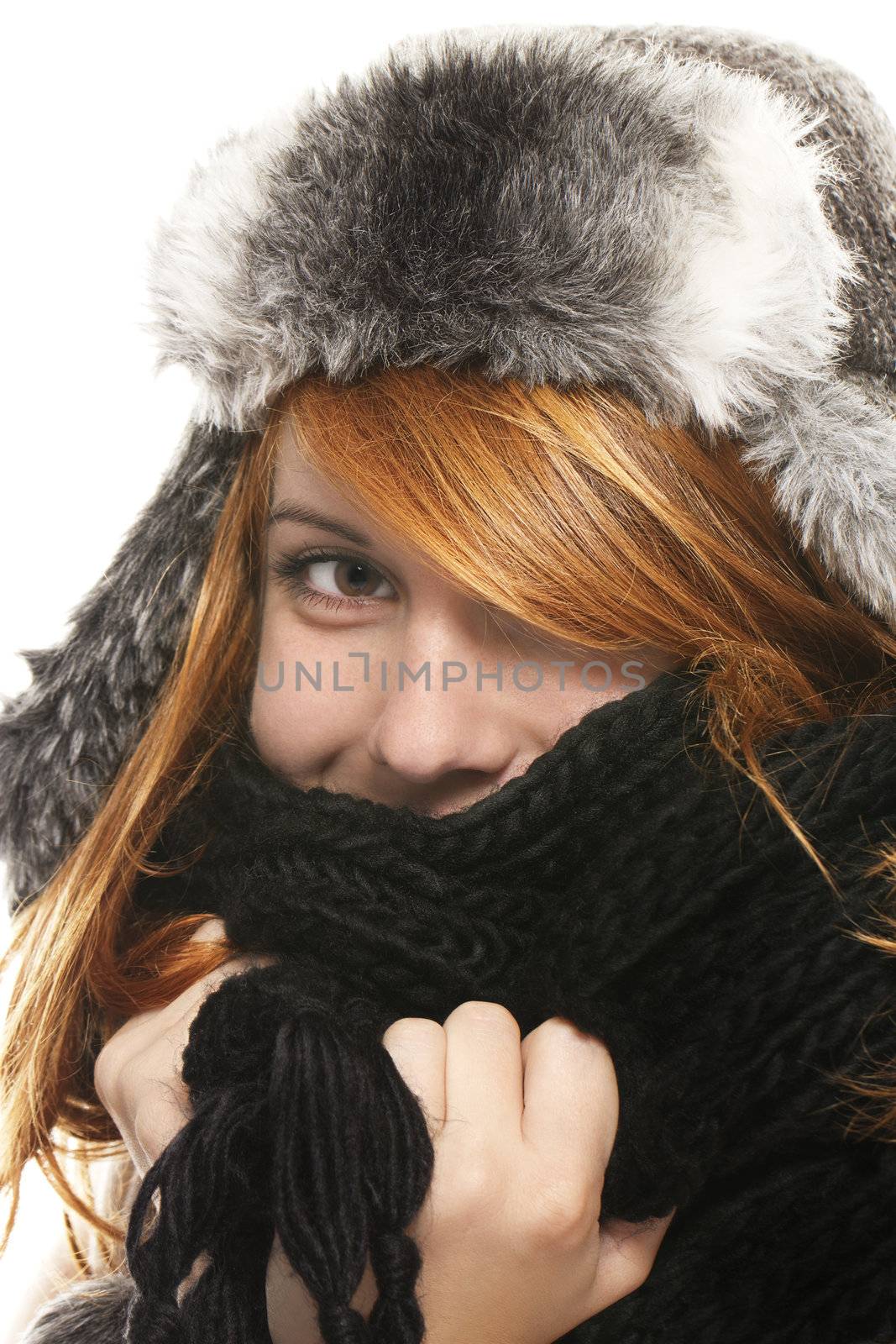 young redhead woman covering in muffler on white background