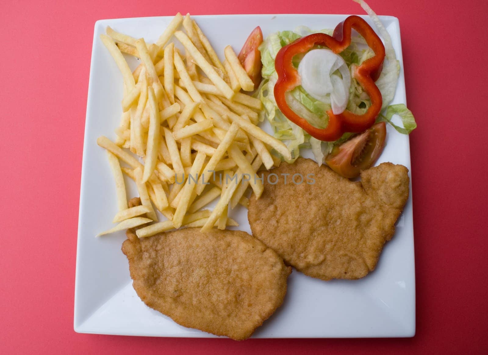 plate of steak with chips and vegetables