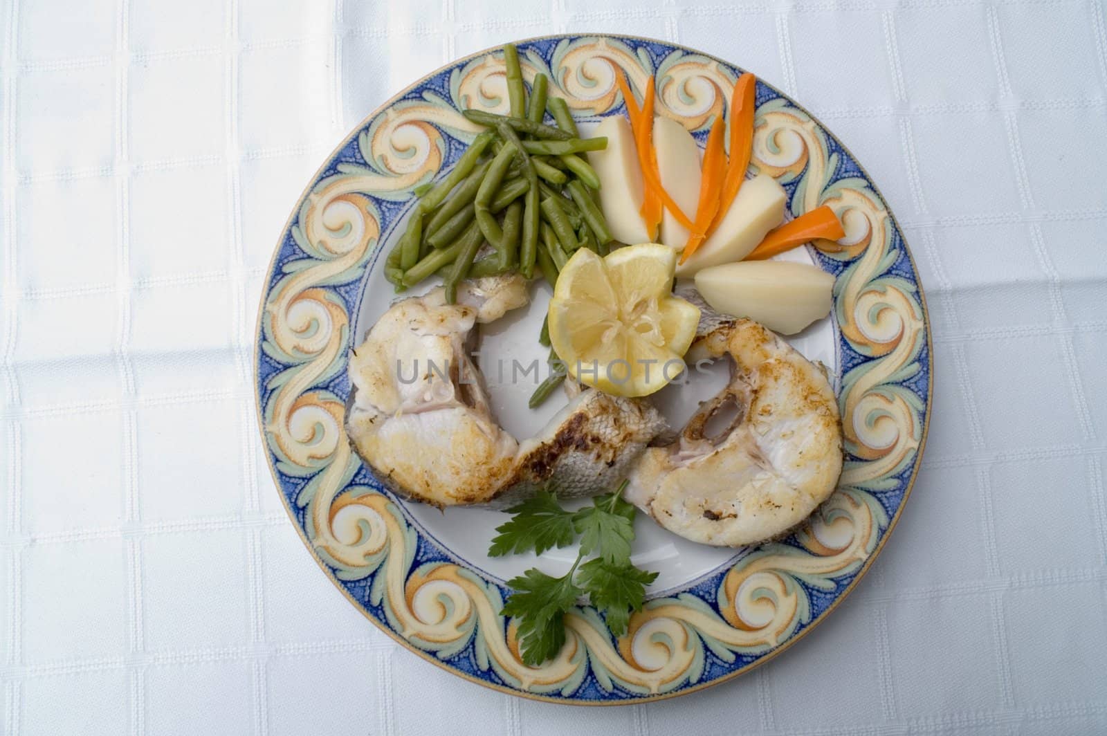 Hake with potatoes and vegetables

