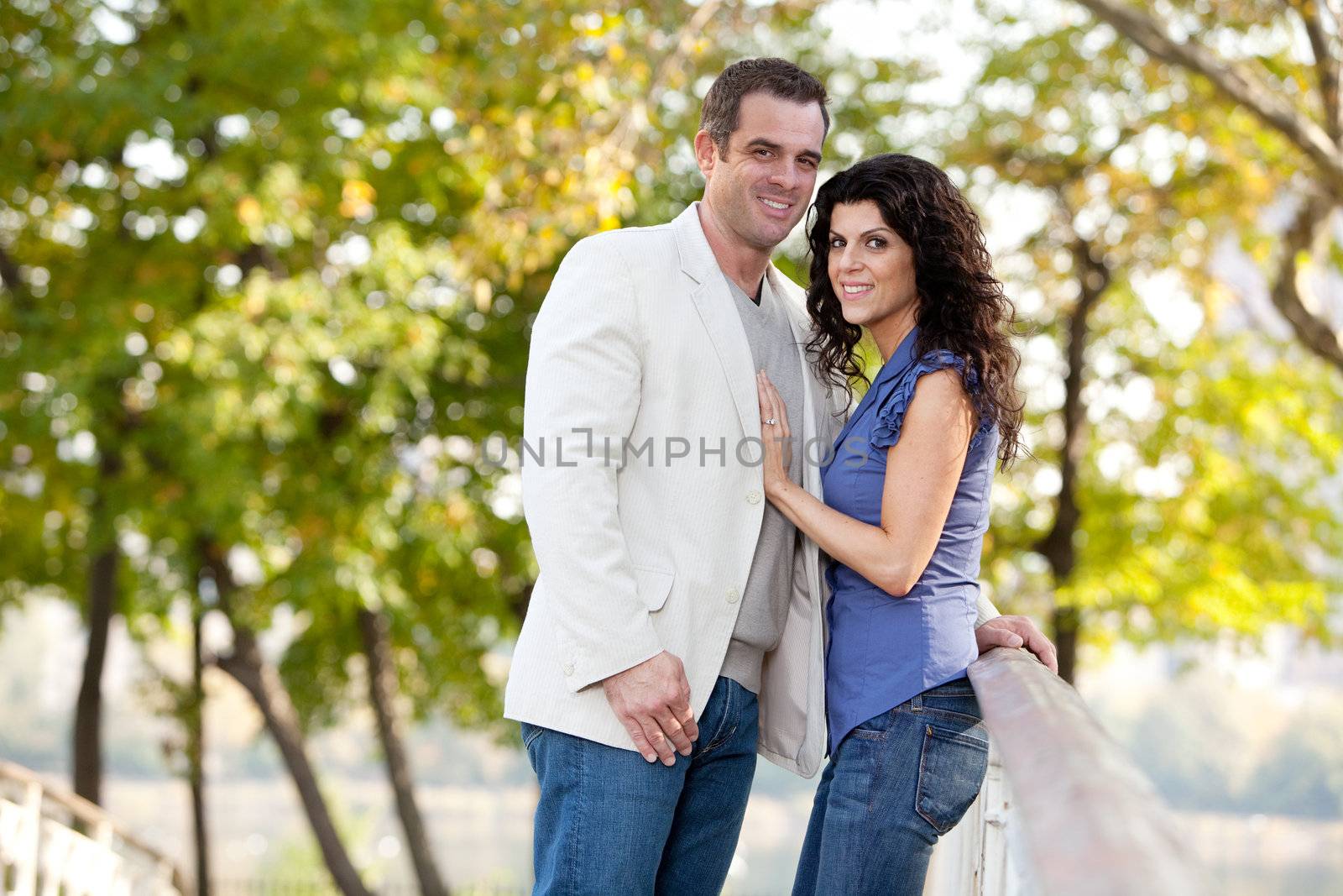 A couple looking at the camera and smiling