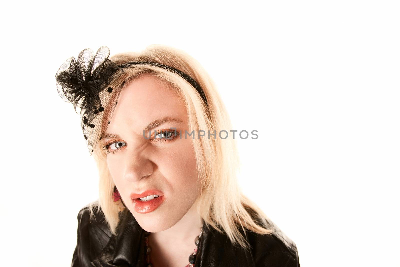 Pretty blonde woman with angry expression on her face