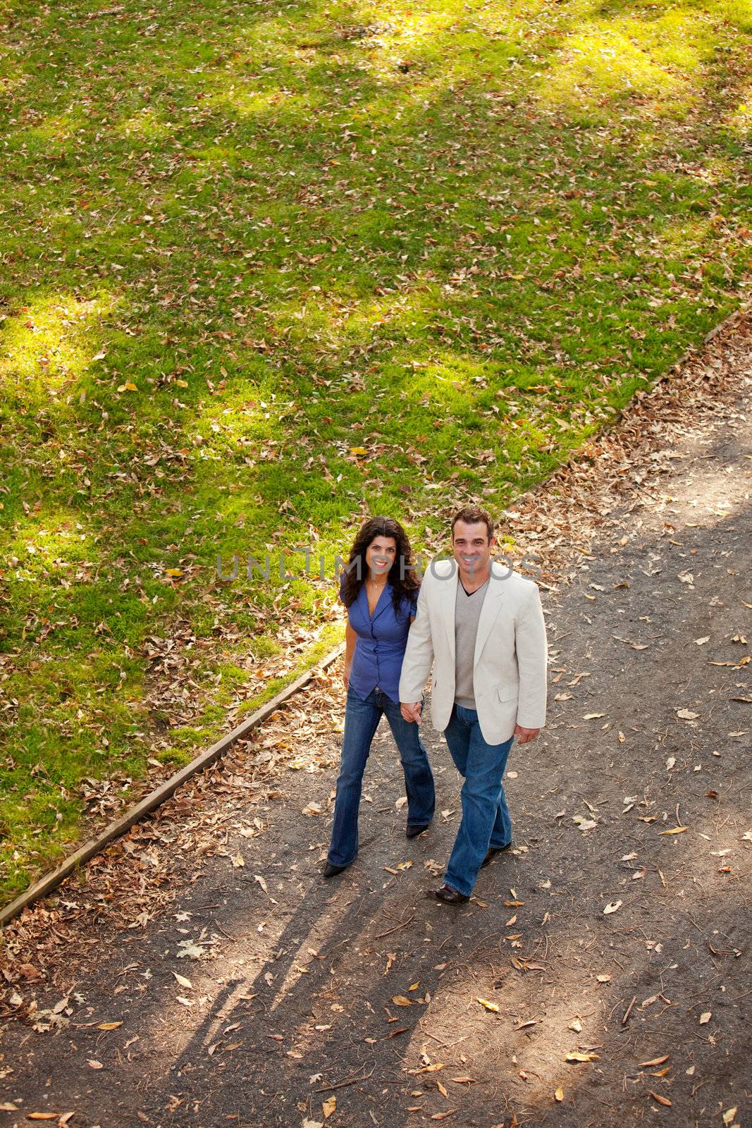 A couple walking in a park on a path