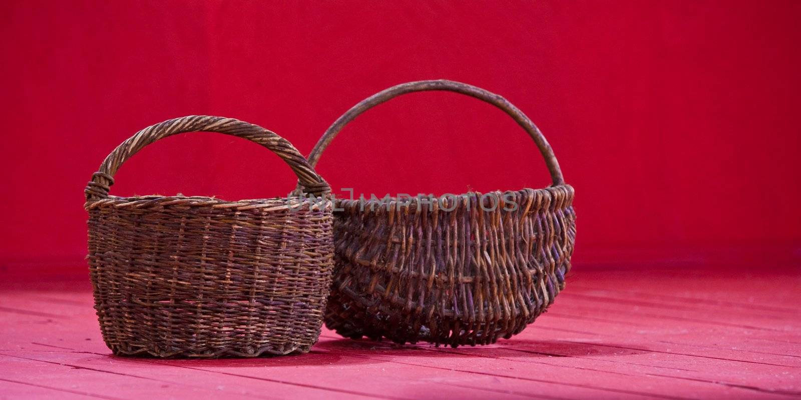 two empty basket on the red background