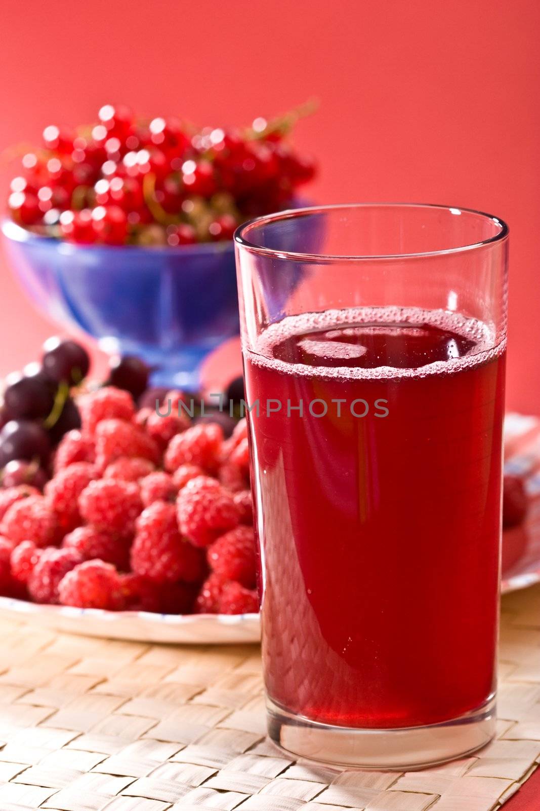 fruit drink on the glass with berry