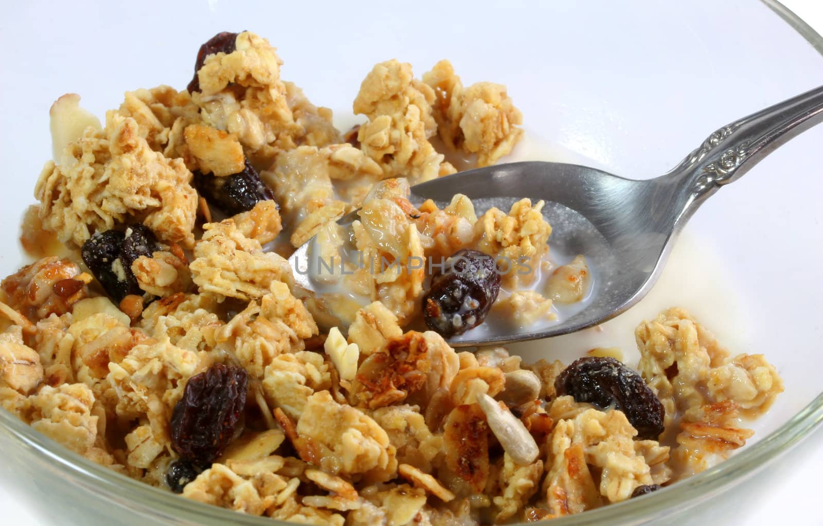 Granola cereal on spoon by Geoarts