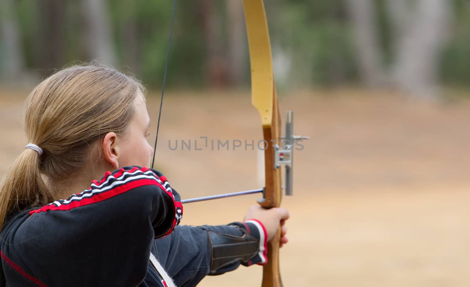 teenage girl doing archery by clearviewstock