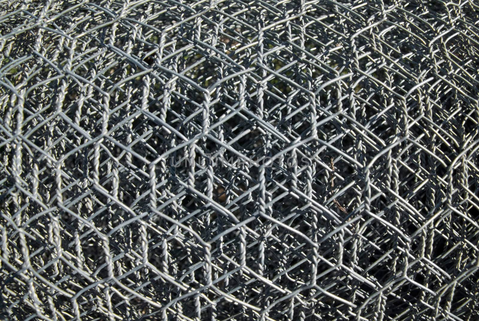 background image of rolls of metal wire mesh