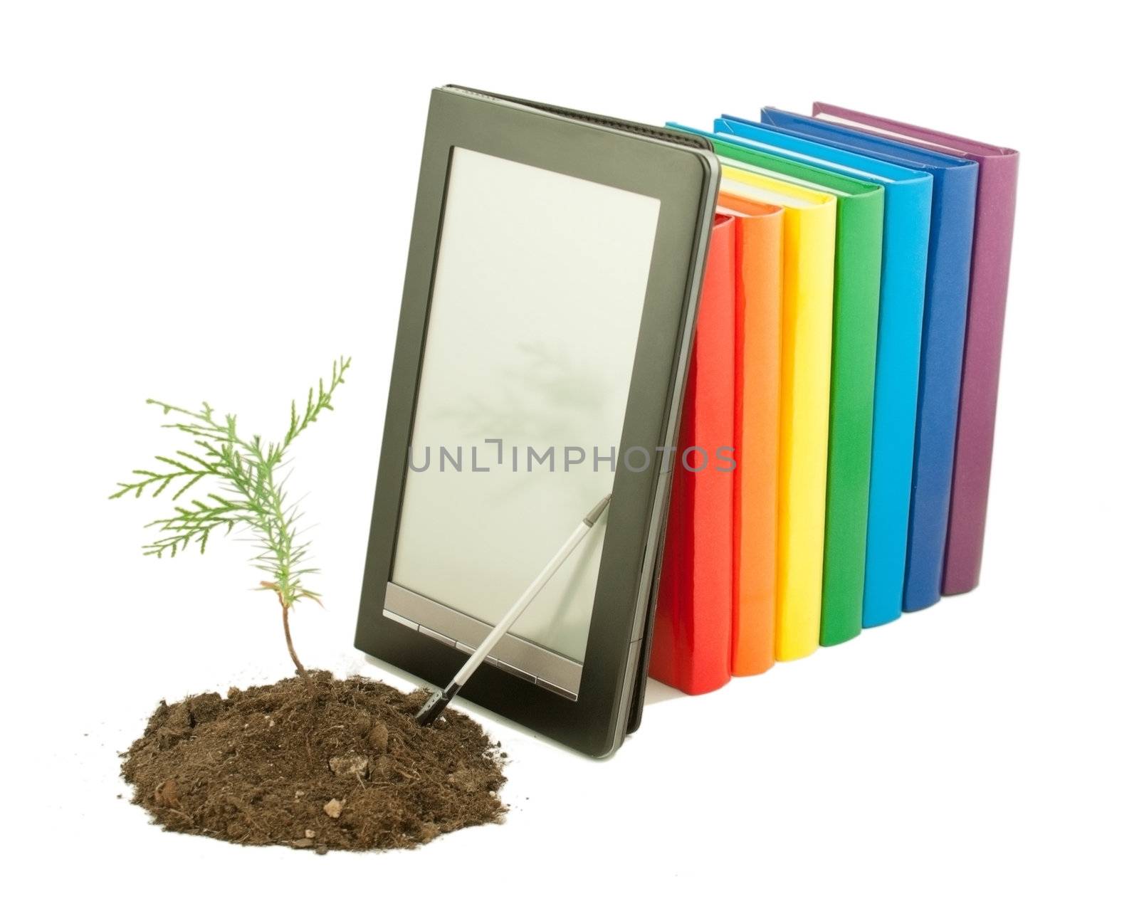 Tree seedling with row of books and electronic book reader behind isolated on white