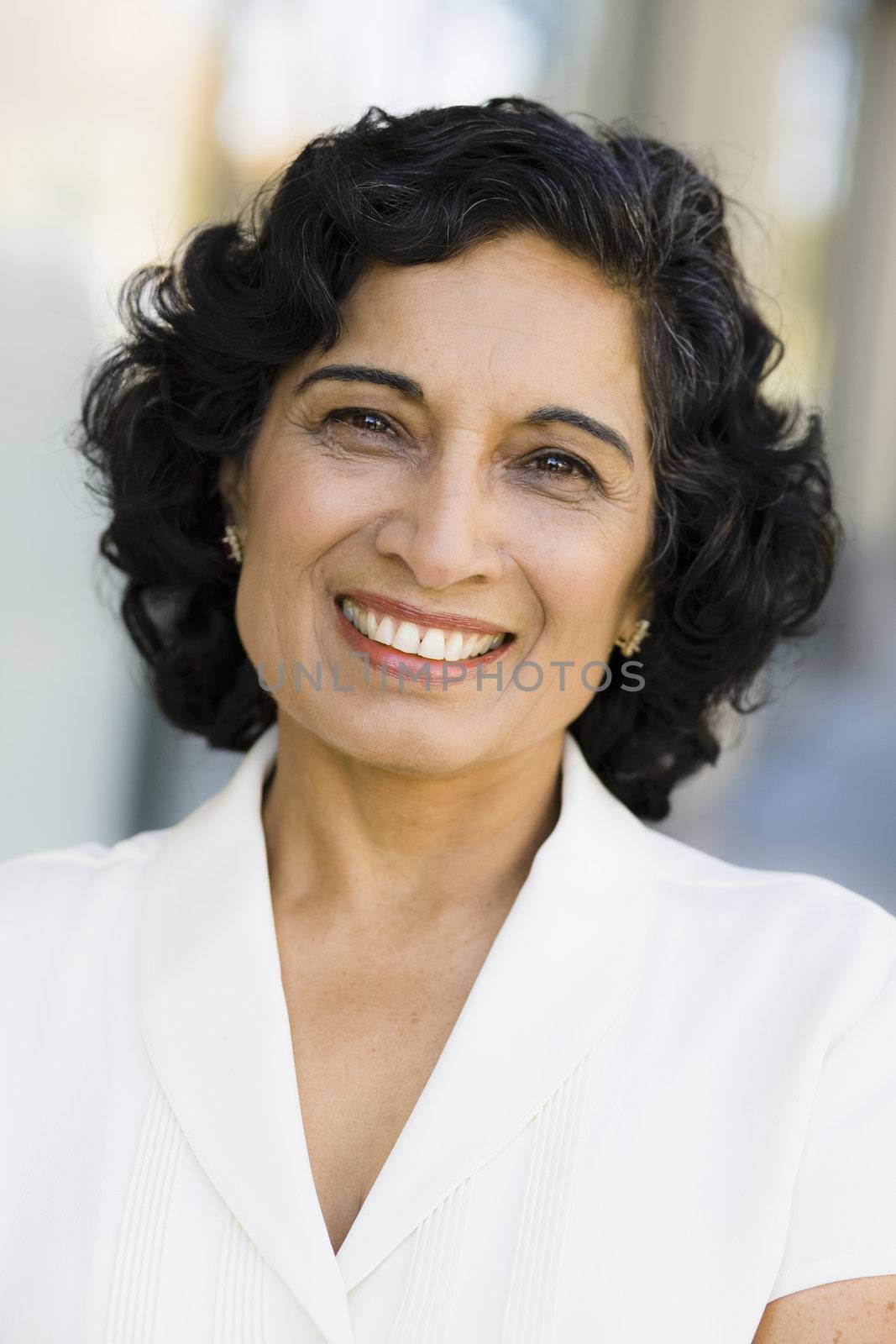 Portrait of a Smiling Indian Businesswoman Looking Directly To Camera