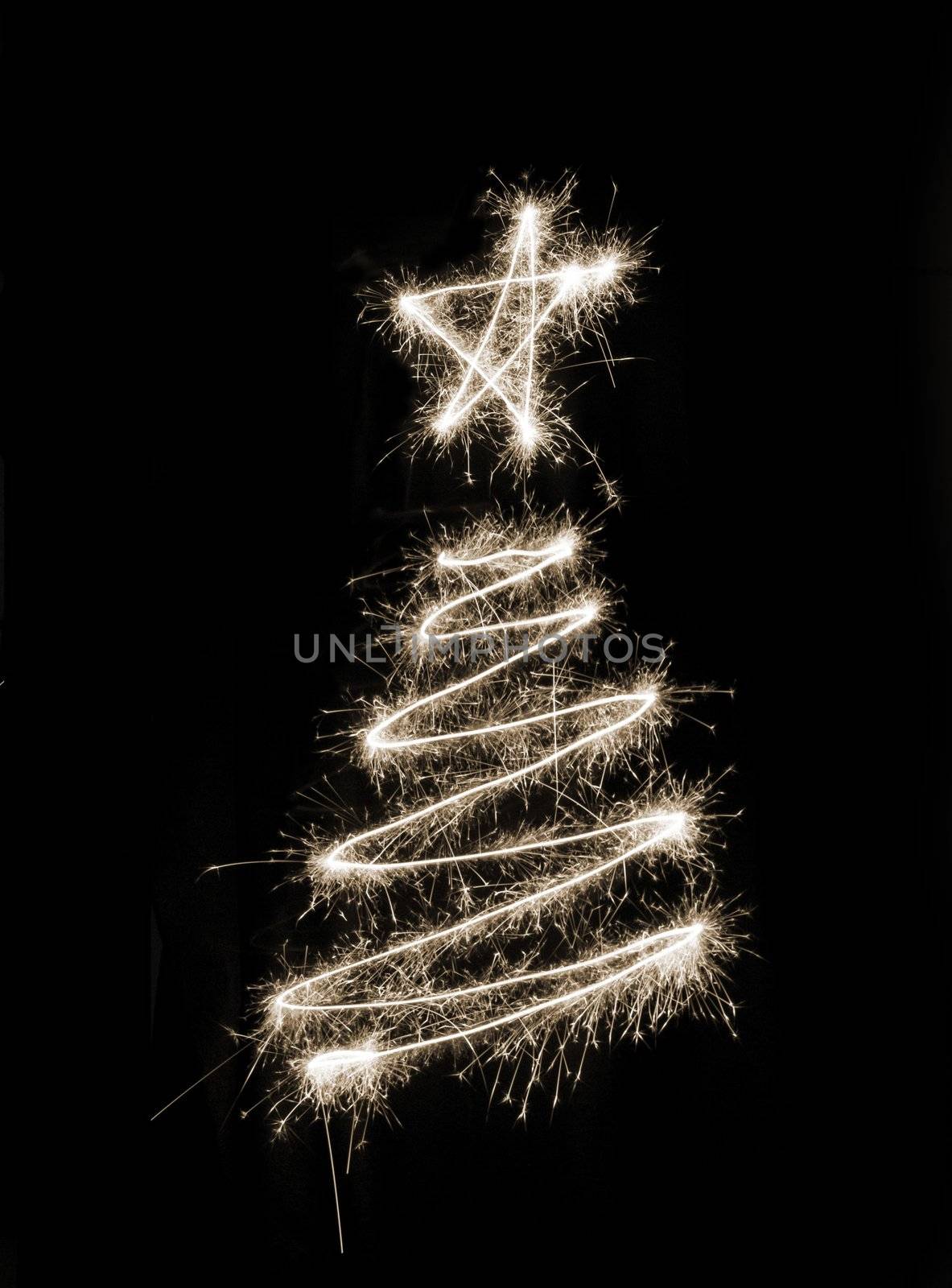 A christmas tree symbol drawn in sparkler trails