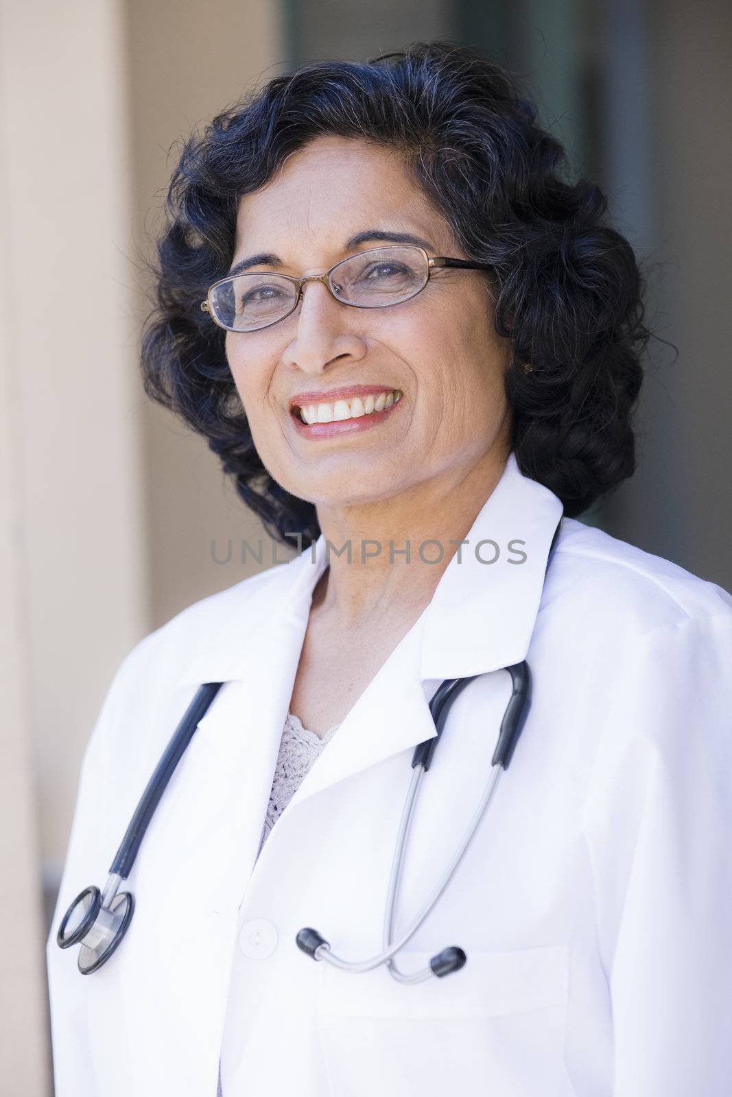 Portrait of a Mature Indian Female Doctor Standing Outdoors
