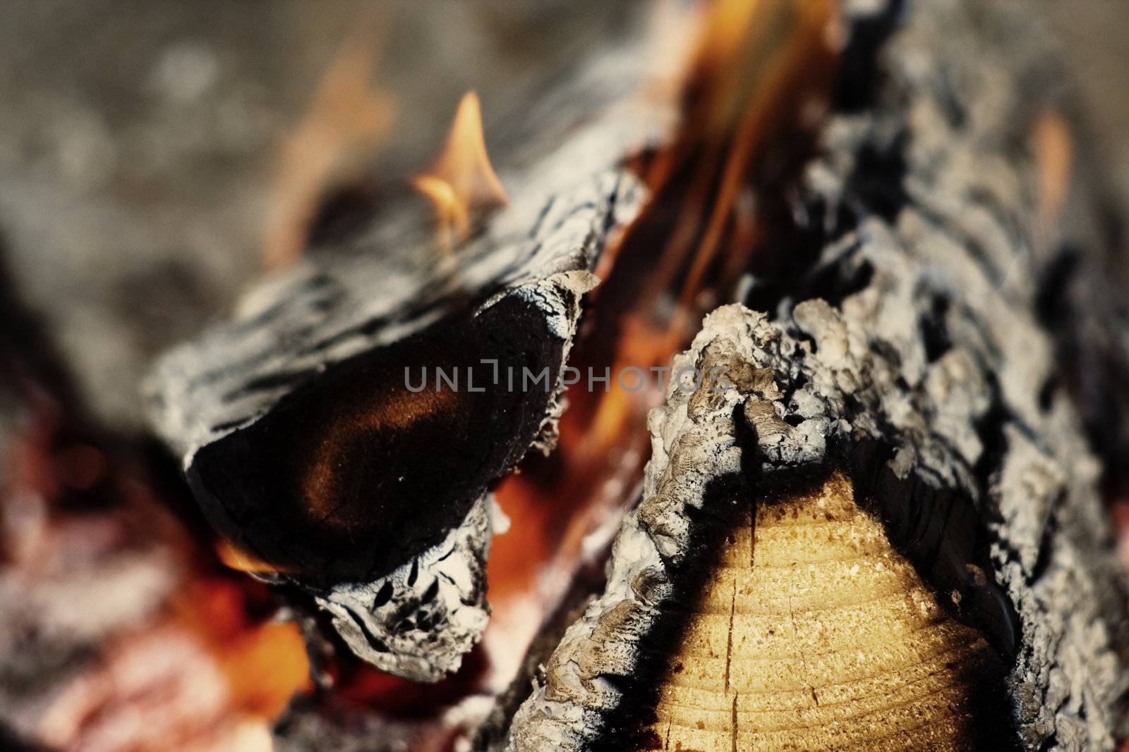 Closeup fireplace with burning fire woods in winter chritmas time.