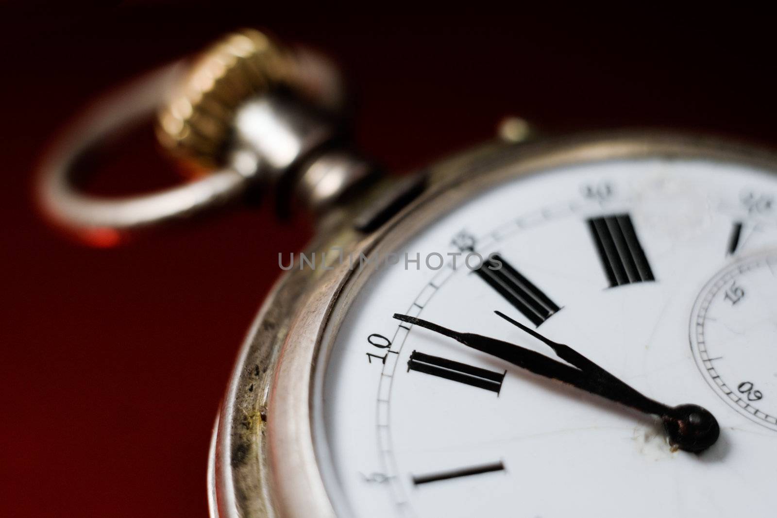 Clock face antique old silver pocket watches on a red background, photo for yours design, postcard, album, cover, scrapbook, etc.