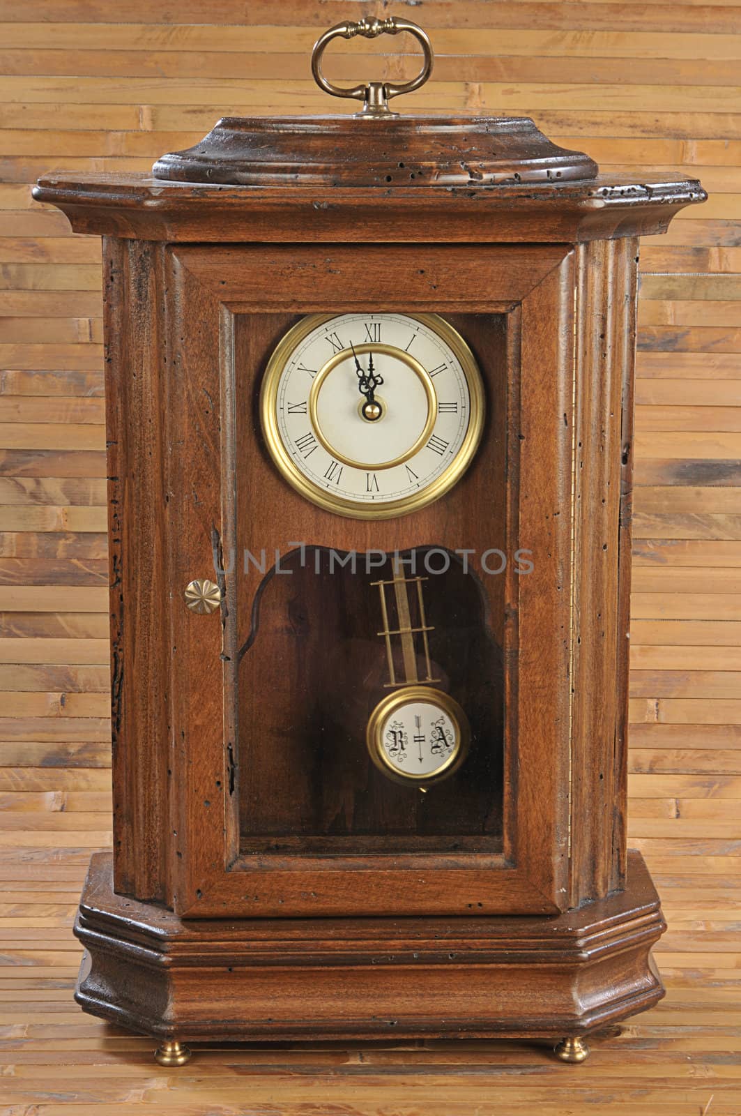 isolated old-fashion wooden clock with pendulum by dyoma