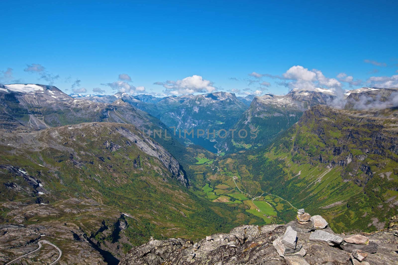 The Geiranger fjord in Norway, surrounded by high mountains