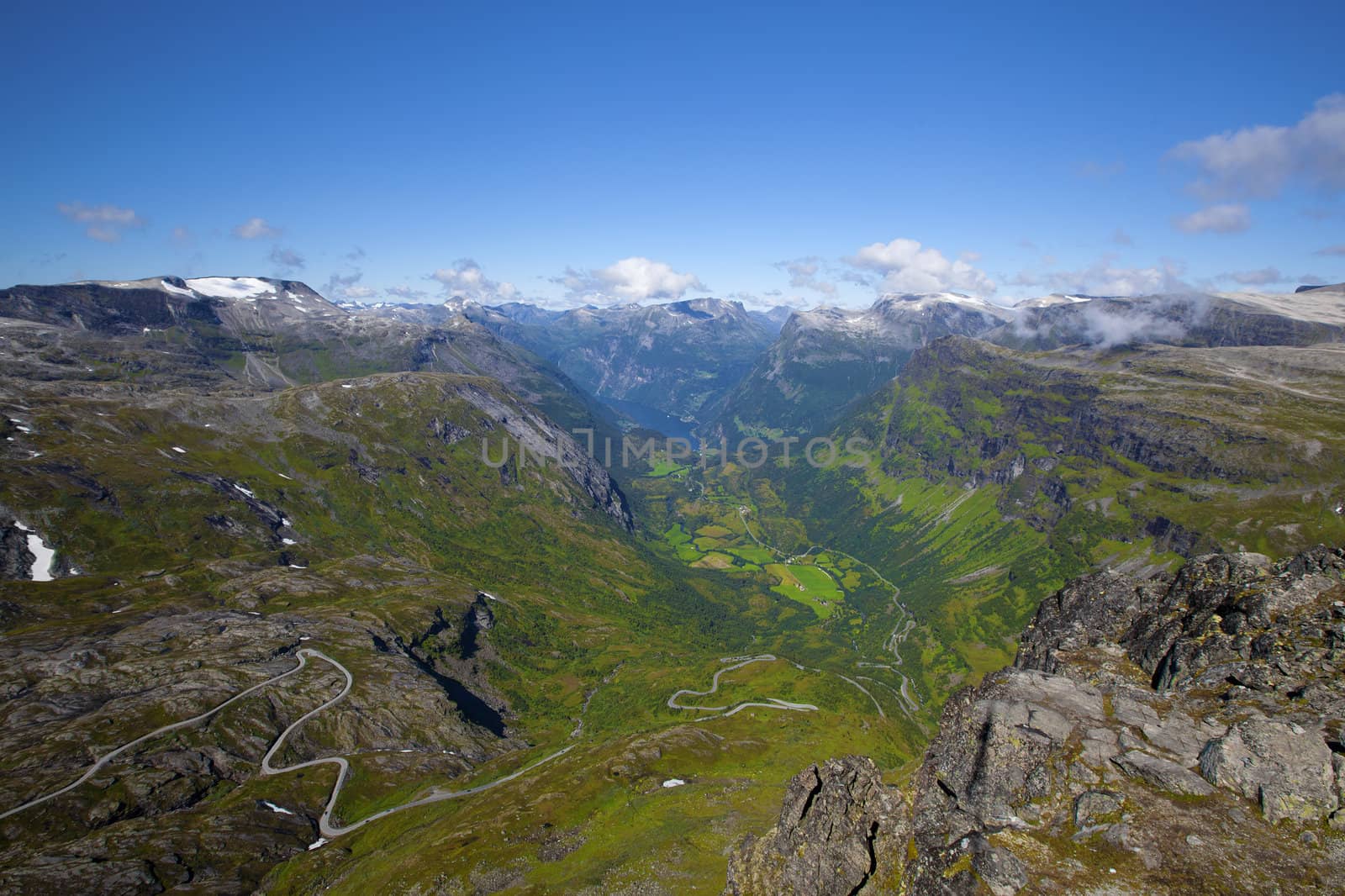 The Geiranger fjord in Norway, surrounded by high mountains